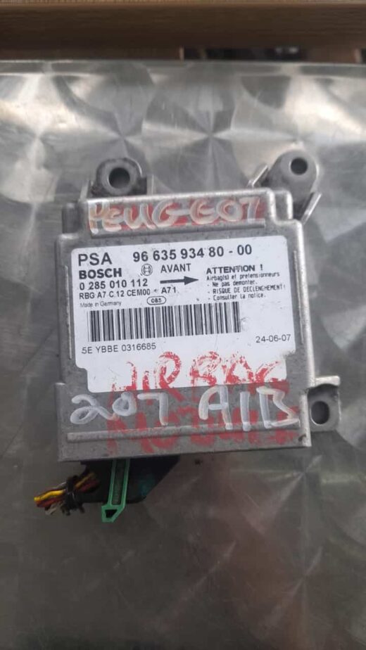 Peugeot 207 Airbag Control Module 9663593480 Front view of a Peugeot 207 airbag control module with wiring harness on a white background.Front view of a Pe