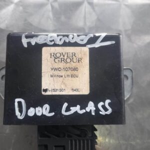 Front angle of a single Land Rover Freelander door glass module showing the window frame and wiring harness.Fr