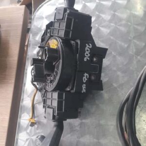 Front view of black automotive combination switch for steering column without condition specified.Front view o