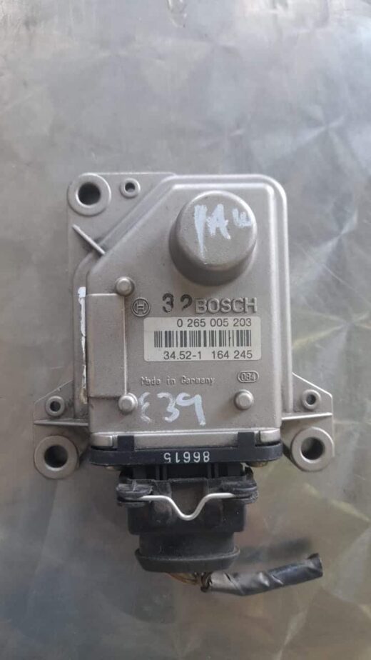 Bmw E39 Yaw Rate Sensor Front view of a yaw rate sensor for BMW E39 displayed on a white background.Front view of a yaw rate sensor fo
