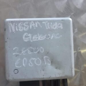 Used Nissan Tiida steering module shown from top angle, highlighting electronic components and connectors.Used