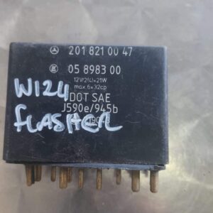 Close-up of a rectangular black turn signal relay flasher from front view with visible mounting holes and labe