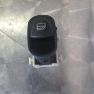 Front view of a black Mercedes W203 driver side window switch panel with control buttons.Front view of a black