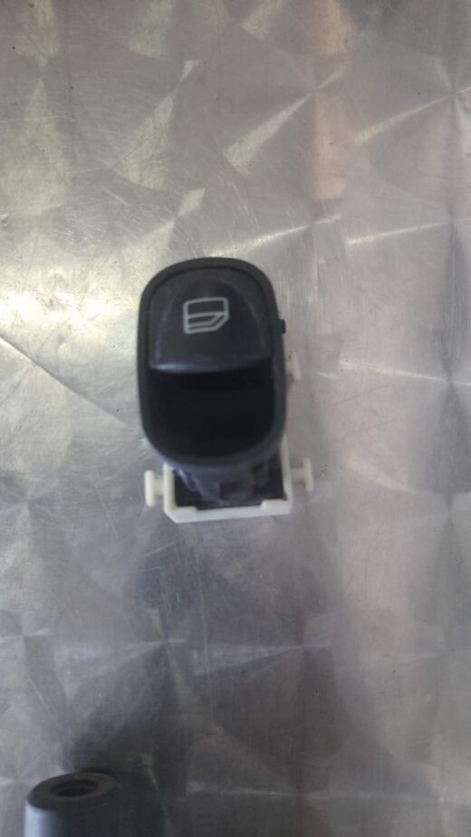 Mercedes W203 Window Switch Front view of a black Mercedes W203 driver side window switch panel with control buttons.Front view of a black