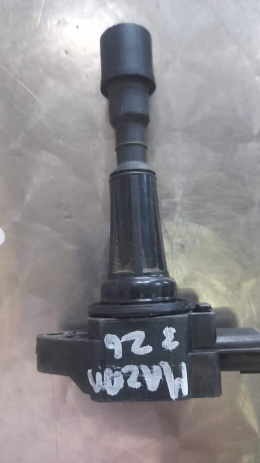 Mazda 3 1.6 Z6 Coil Front view of a used coil for Mazda 3 1.6 Z6, showing the main cylindrical body and spring assembly.Front view
