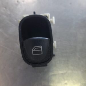 Front view of used Mercedes W203 window switch with buttons and connector for driver side panel.Front view of