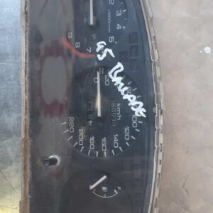 Front view of a used Honda Ballade dashboard instrument cluster showing speedometer and gauges.Front view of a