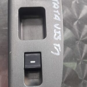 Front angled view of a black Tata Vista car window switch panel with four buttons.Front angled view of a black