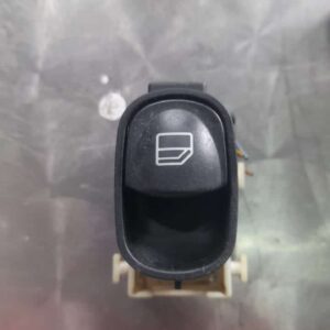 Front view of a car window switch panel with control buttons, shown as main featured image.Front view of a car