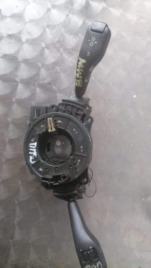 Bmw E36 Combination Switch / Stalk Used BMW E36 combination switch/stalk shown from side angle with visible connectors and control levers.Used BM