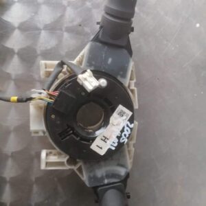 Front-facing view of a black combination switch/stalk for Nissan Xtrail, showing control levers and connectors