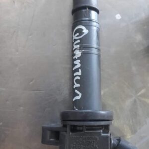 Front view of a new ignition coil for Toyota Quantum, showing connector and coil body details.Front view of a
