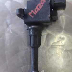 Front angled view of a single ignition coil showing electrical connector and rubber boot attachment.Front angl