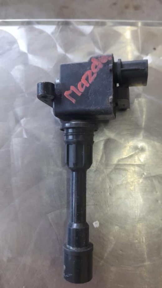 Mazda 3 Ignition Coil Front angled view of a single ignition coil showing electrical connector and rubber boot attachment.Front angl