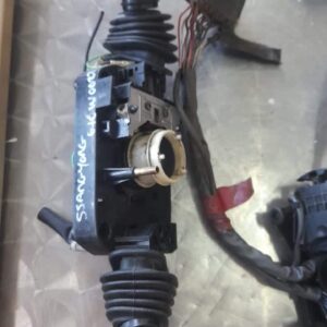 Front view of a Ssangyong Musso headlight switch panel with control knob and indicator icons.Front view of a S