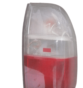 Right taillight for Mitsubishi Colt shown from rear angle against white background.Right taillight for Mitsubi