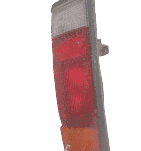 Right rear taillight of Nissan Hardbody shown from the side, clean and fully intact.Right rear taillight of Ni