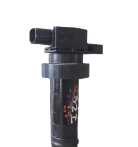 Hyundai I20 ignition coil angled showing top and side connectors on plain background.Hyundai I20 ignition coil