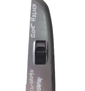 Front view of a used black window switch for a Toyota Hilux, showing buttons and connector side.Front view of