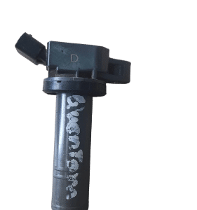 Front view of a clean Toyota Quantum ignition coil on a white background.Front view of a clean Toyota Quantum