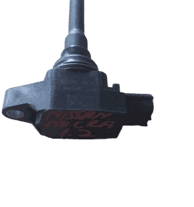 Used ignition coil for Nissan Micra HR12, front view on clean white background.Used ignition coil for Nissan M