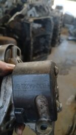Close-up side view of a tensioner pulley for Ford Ranger WL, clean metal surface visible.Close-up side view of