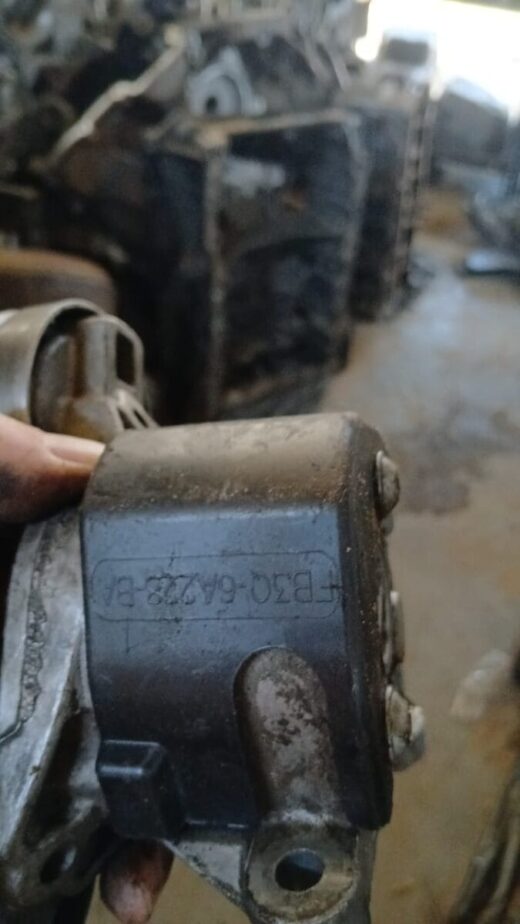 Close-up side view of a tensioner pulley for Ford Ranger WL, clean metal surface visible.Close-up side view of