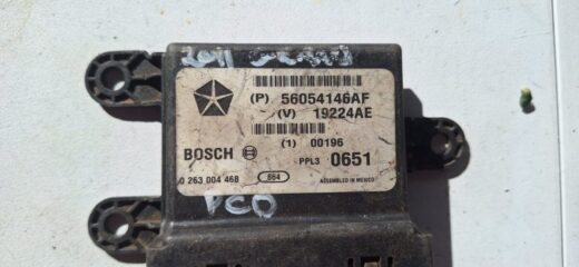 Front-facing view of a rectangular electronic PCD module with multiple connectors and labels on top.Front-faci