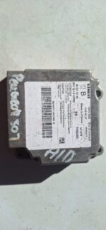 Front view of a Peugeot 307 airbag module showing wiring and connectors, clean and intact.Front view of a Peug
