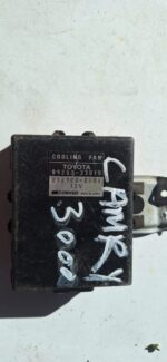 Front angle view of a radiator fan module showing the housing and cooling fan blades.Front angle view of a rad