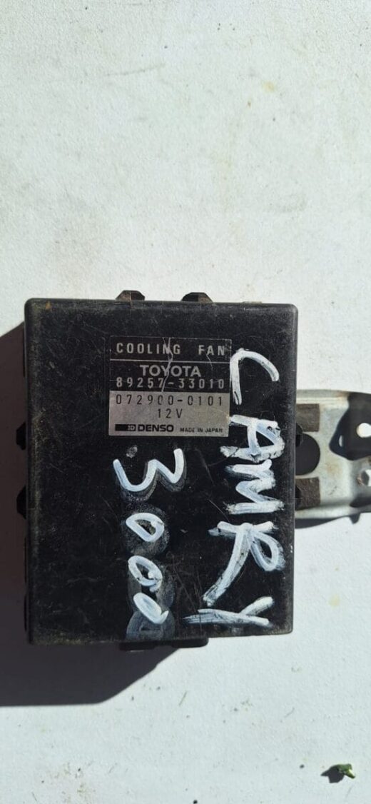Front angle view of a radiator fan module showing the housing and cooling fan blades.Front angle view of a rad