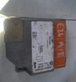 Front view of a BMW E36 airbag module with wiring and connectors visible.Front view of a BMW E36 airbag module