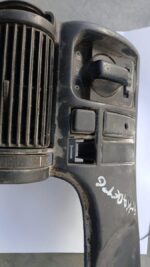 Front view of a 1995 Opel Kadette headlight switch and cover assembly on a white background.Front view of a 19