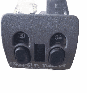 Top-down view of a used Chrysler Neon demister switch with wiring connector attached.Top-down view of a used C