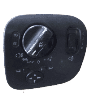 Front view of a used Mercedes W203 car headlight switch with circular knob and wiring connector.Front view of