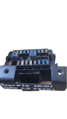 Mahindra Scorpio Fusebox Front view of a new fusebox for a Mahindra Scorpio showing top and side connectors.Front view of a new fusebox