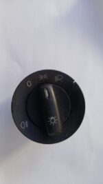 Used VW Polo headlight switch shown from front angle with visible control knob and markings.Used VW Polo headl