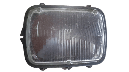 Nissan 1400 Headlight Front view of a like new Nissan 1400 headlight replacement, clean lens and intact housing.Front view of a like