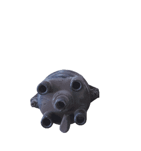 Front angled view of a 4-cylinder distributor cap showing contact points and rotor seat.Front angled view of a