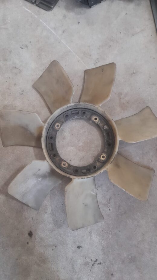Radiator Fan Blade Front angled view of a new black radiator cooling fan blade with multiple curved blades.Front angled view of a