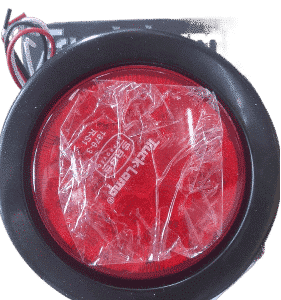 Rear truck brake light viewed from the back, showing lens and connectors clearly.Rear truck brake light viewed