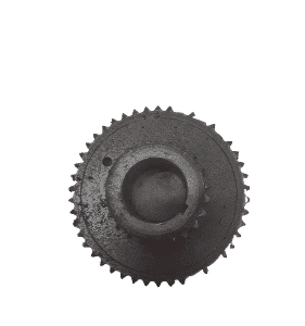 Close-up of a clean, new cam sprocket positioned upright showing gear teeth and mounting holes.Close-up of a c
