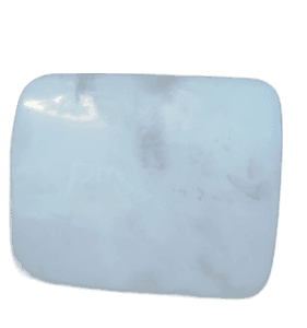 Close-up front view of a fuel flap designed for Mitsubishi Pajero, shown isolated on a white background.Close-