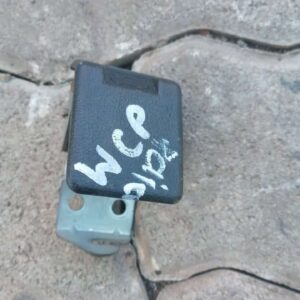 Front view of a Pajero bonnet lever angled with mounting points visible in used condition.Front view of a Paje
