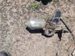Used car wiper motor shown from a side angle, highlighting mounting points and electrical connector.Used car w