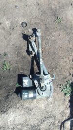 Front angle view of a used Mercedes W168 wiper motor showing mounting points and electrical connector.Front an