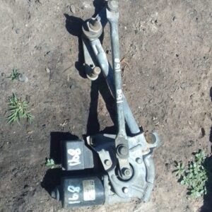 Front angle view of a used Mercedes W168 wiper motor showing mounting points and electrical connector.Front an