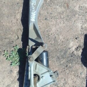 Front angle view of a used Mercedes W203 windshield wiper motor with attached wiring and mounting points.Front