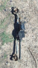 Front view of a used car wiper motor assembly for a 2006 Toyota Corolla showing mounting points and electrical