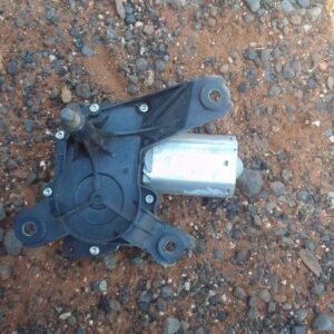 Used rear wiper motor assembly positioned to show mounting points and electrical connector side.Used rear wipe